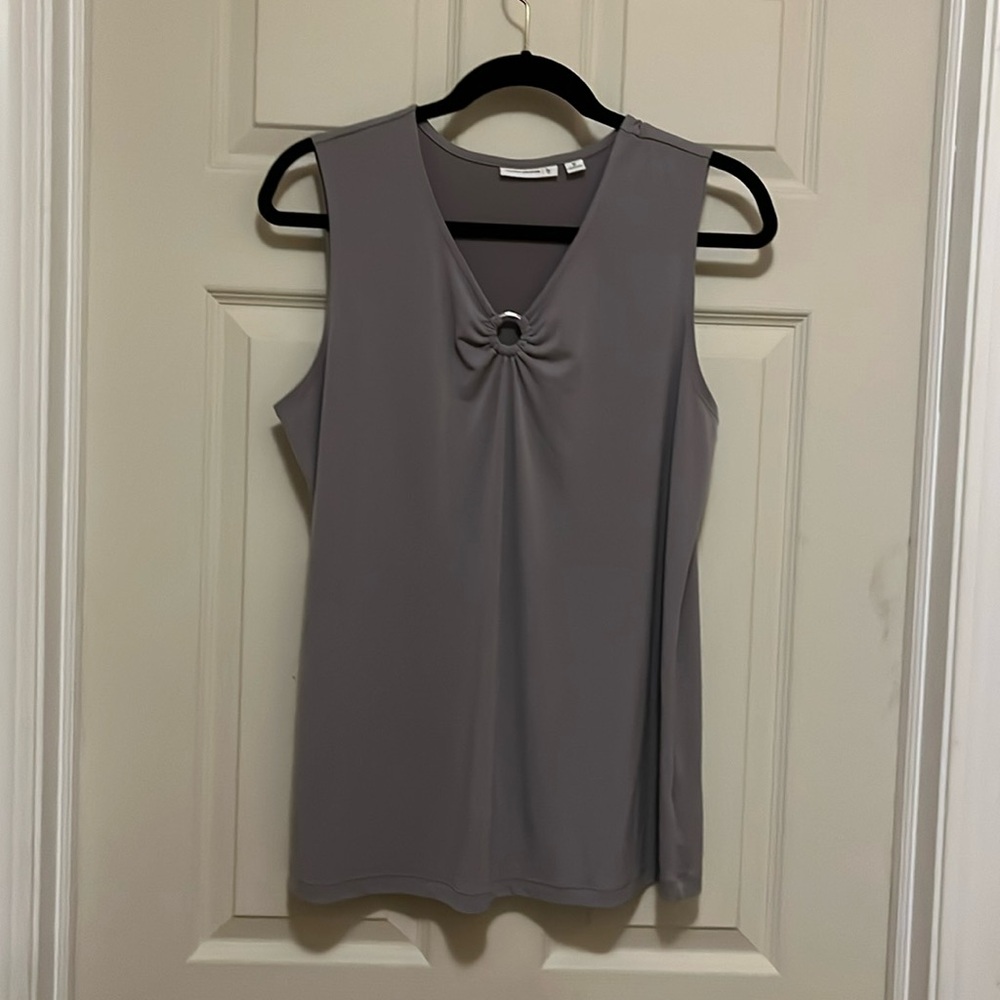 Gray sleeveless top.